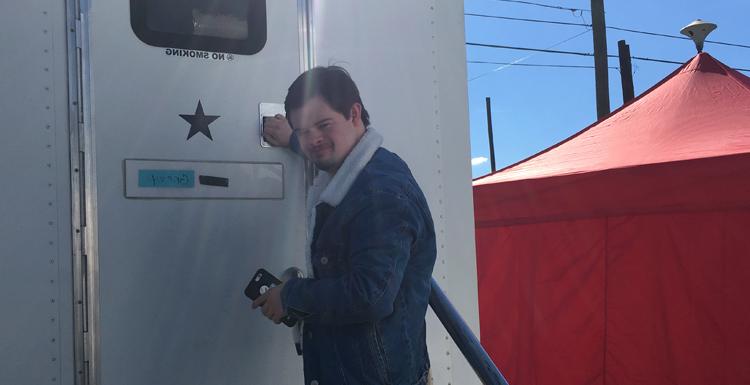 Former South student Benjamin Pelham outside of his trailer on the set of the film "Embattled."